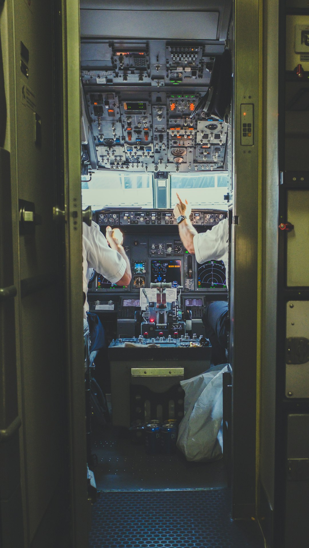 embark pilot-and-copilot-inside-plane-cockpit-c56y966zoxc