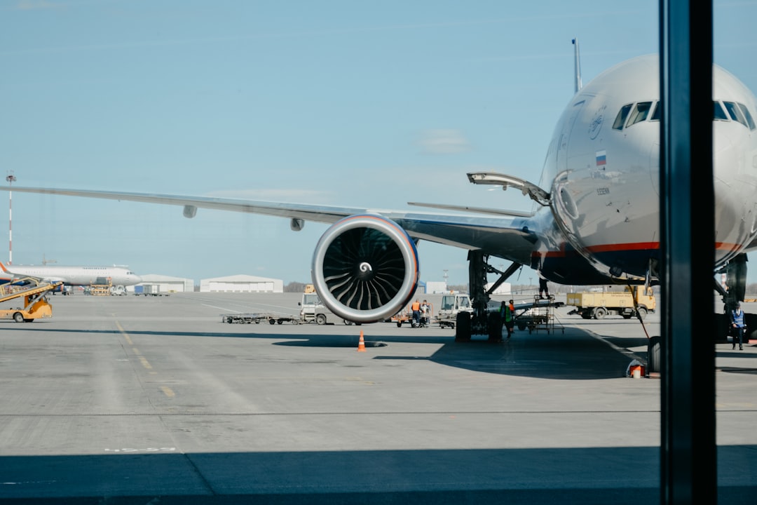 services-03 white-airliner-on-runway-tcp2k2sypfg
